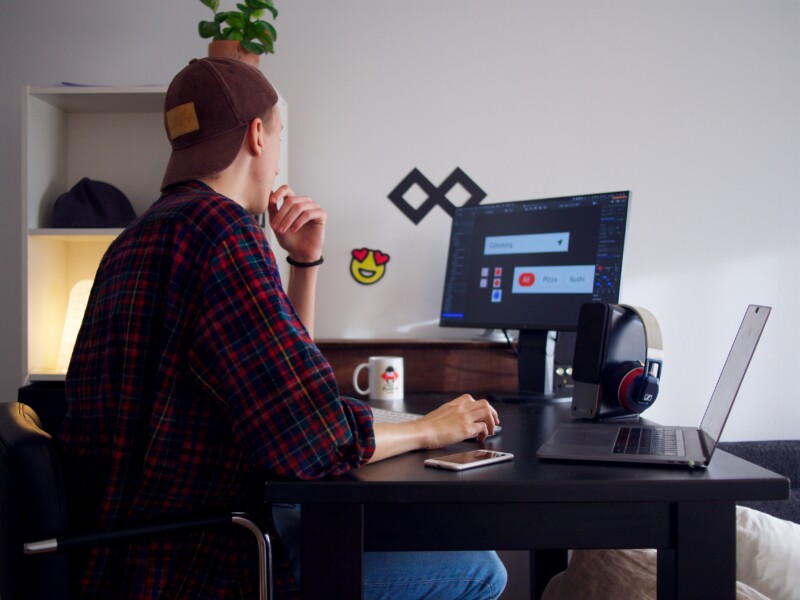 Man sitting near the table using computer