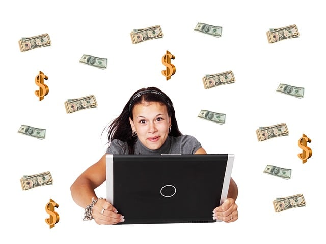 Woman Holing a Laptop with Money in the Background