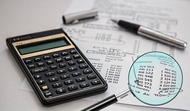 Magnifying Glass with Paper and Pen