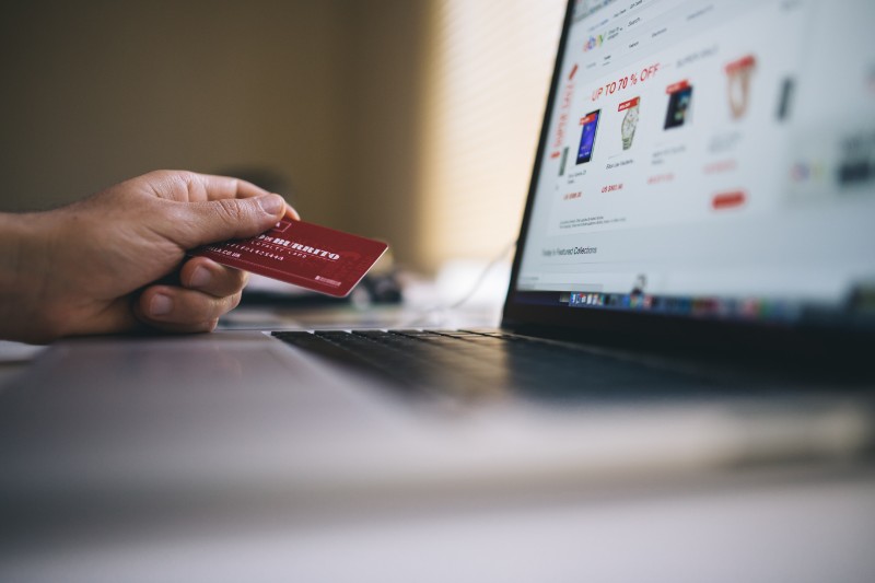 person holding a credit card