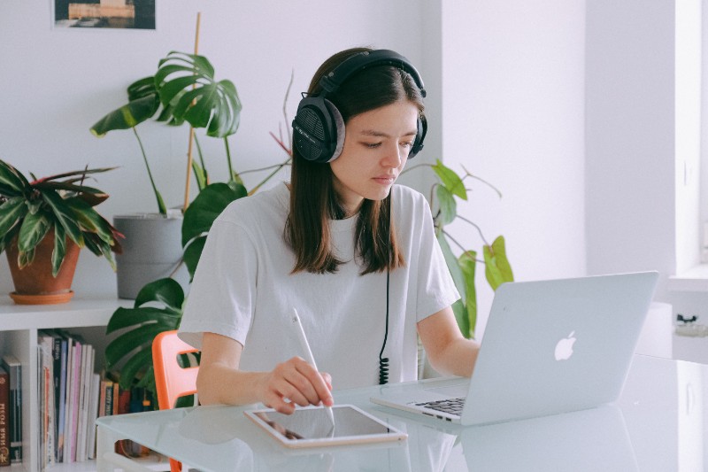 woman-in-white-shirt-using-silver-macbook