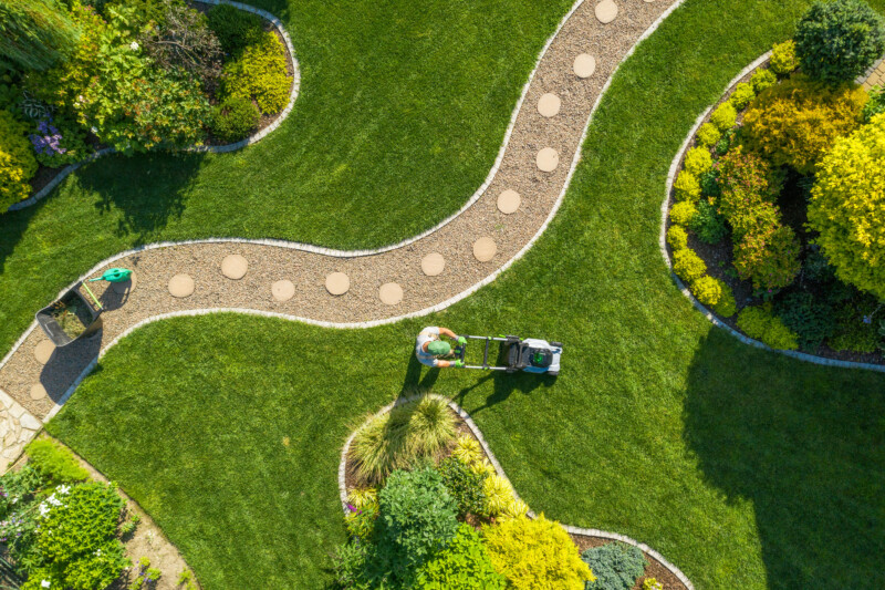 Man moving the garden grass 