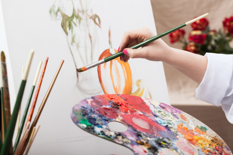 Artist painting on a canvas 