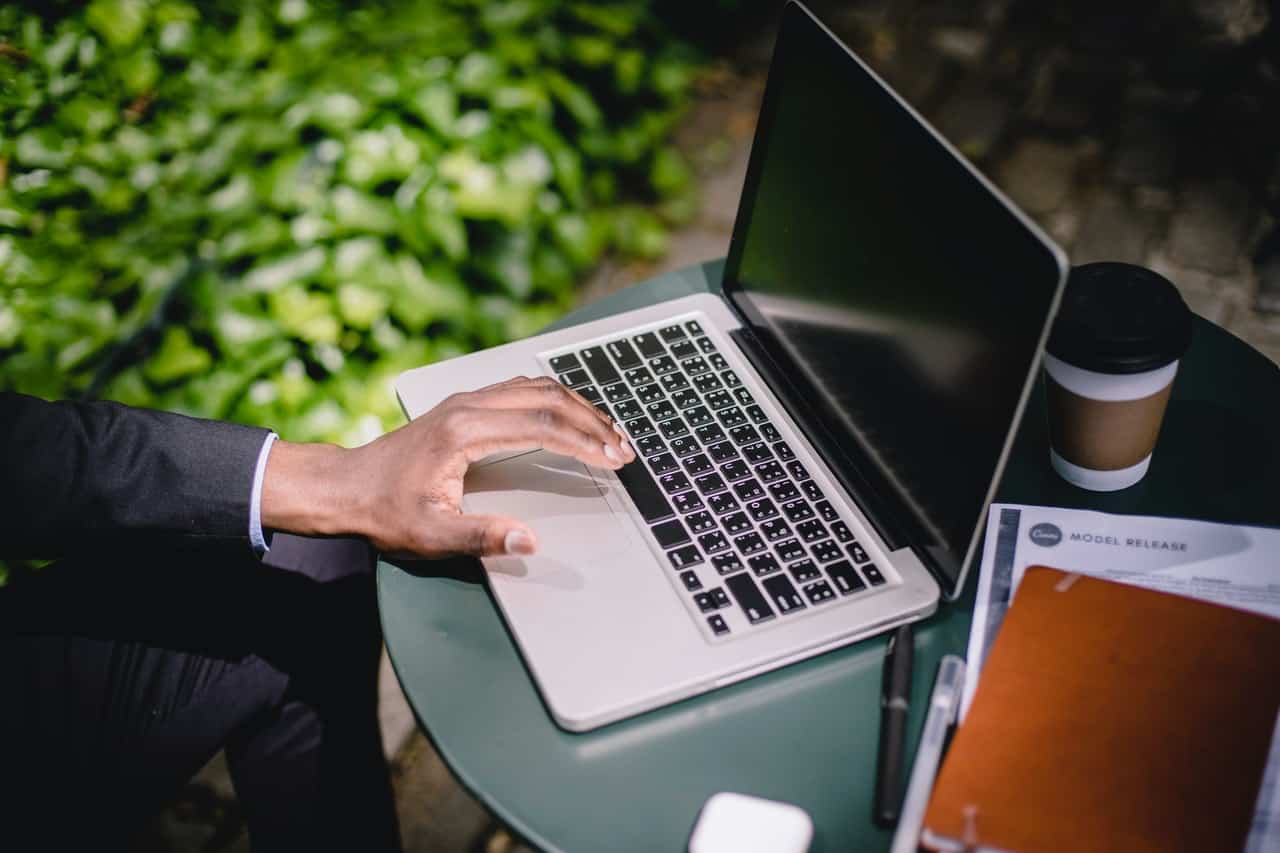 Freelancer with Laptop and Cup of Coffee