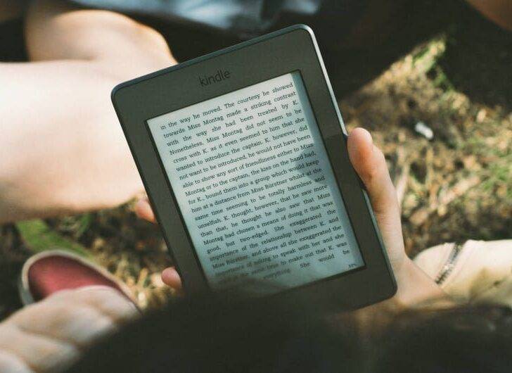 A reader reading an ebook on Kindle