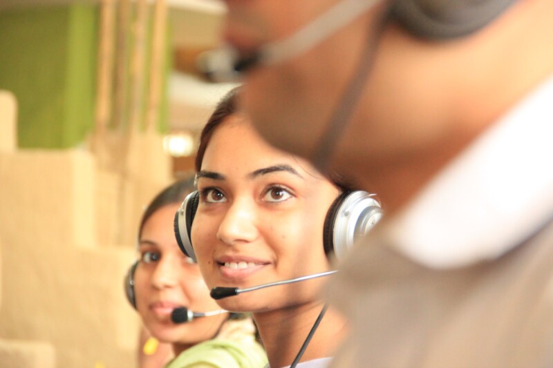 Woman in customer service wearing headphones