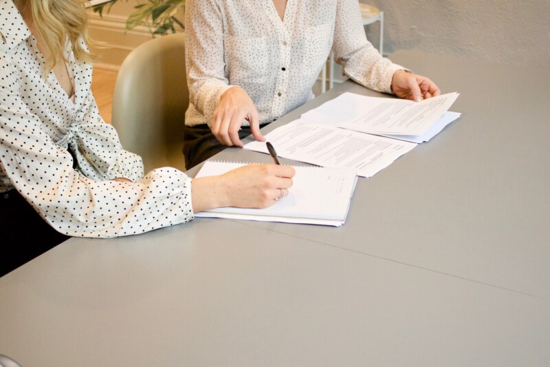 Woman signing on documents