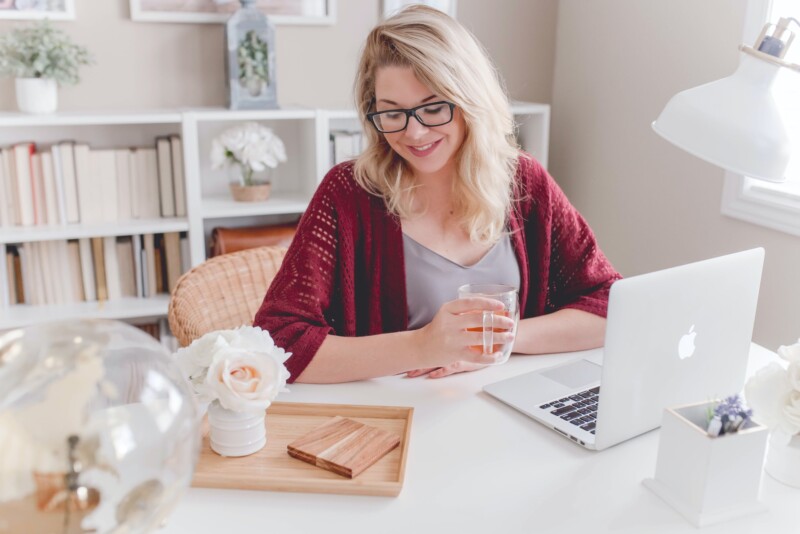 Woman sitting in front of a laptop