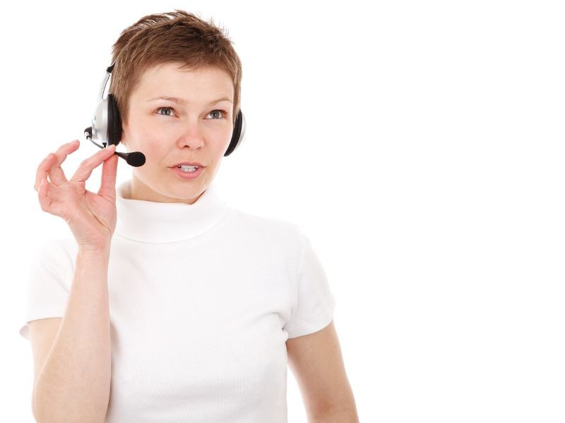 Female customer service representative wearing a white shirt