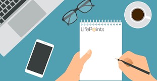 Writing on a memo pad with Lifepoints logo