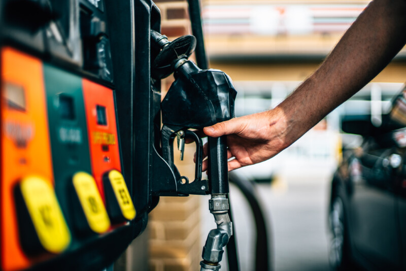 Man holding gas pump