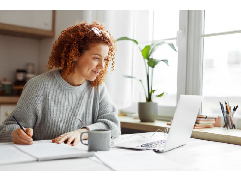 Woman with curly hair researching online