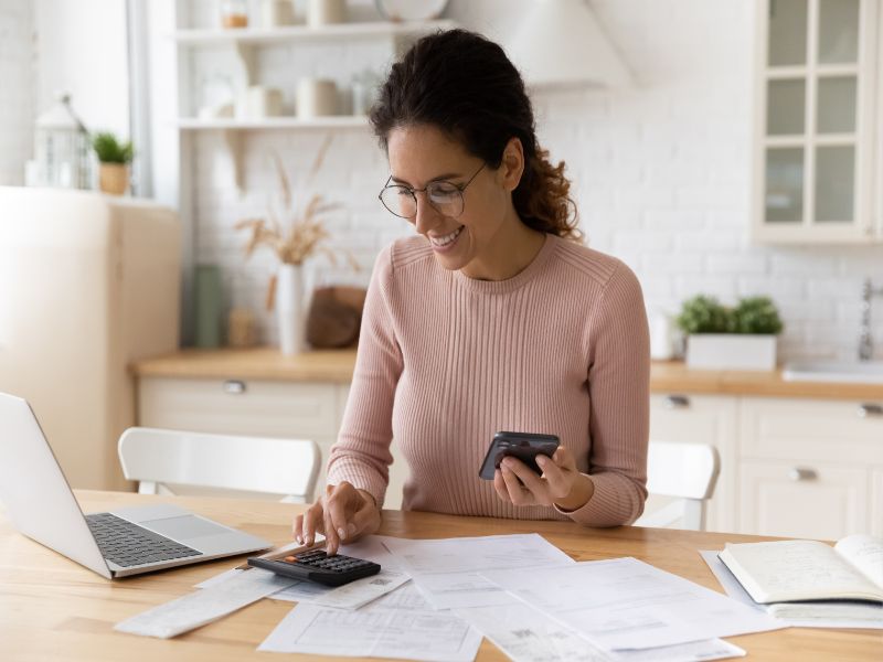 Young latina female work with financial papers