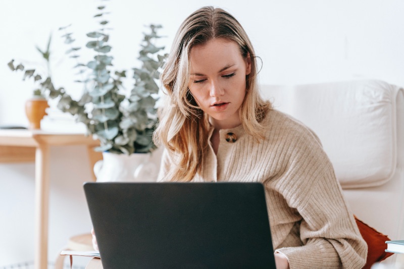 Woman working on laptop at home