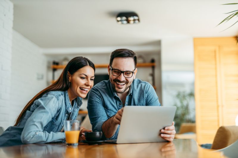 Couple looking at laptop computer together