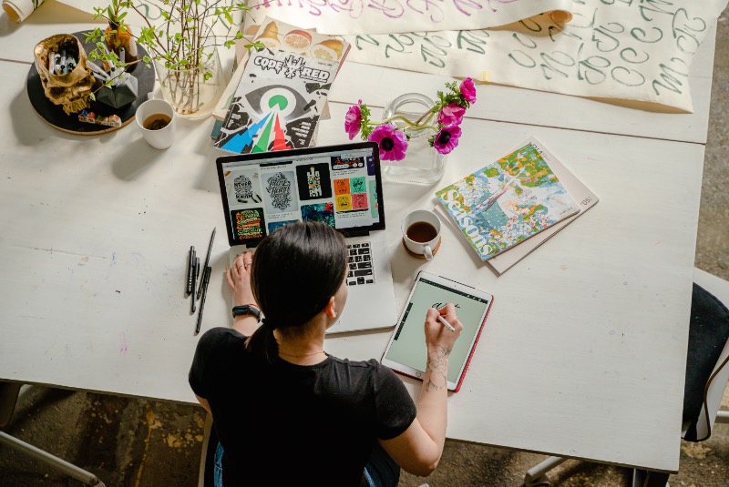 woman doing graphic design on tablet