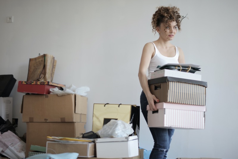 Woman getting rid of some stuff at home