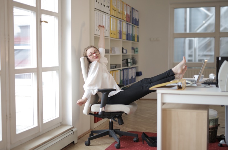 woman relaxing with feet on table