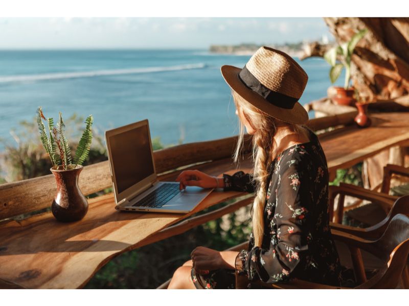 Woman working online while traveling