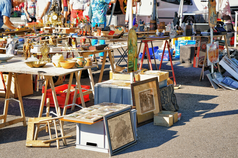 Various goods for selling at the counter in the flea street market in Ascona, Lake Maggiore, Ticino canton, Switzerland