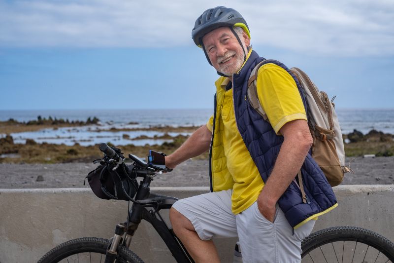 Old man smiling with his bike