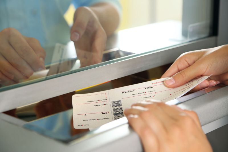 Woman buying tickets at box office