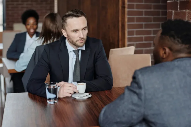 Businessmen Having a Meeting at a Cafe