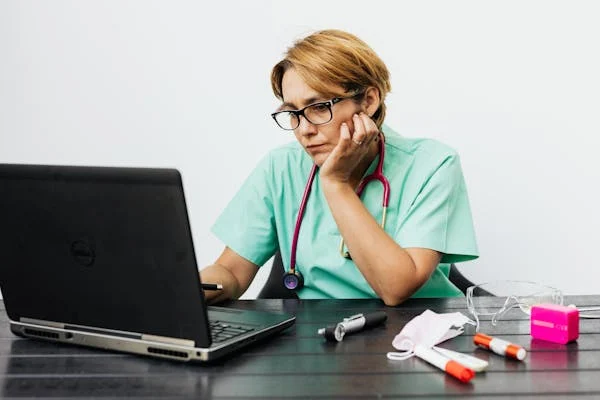 A nurse working on health blog